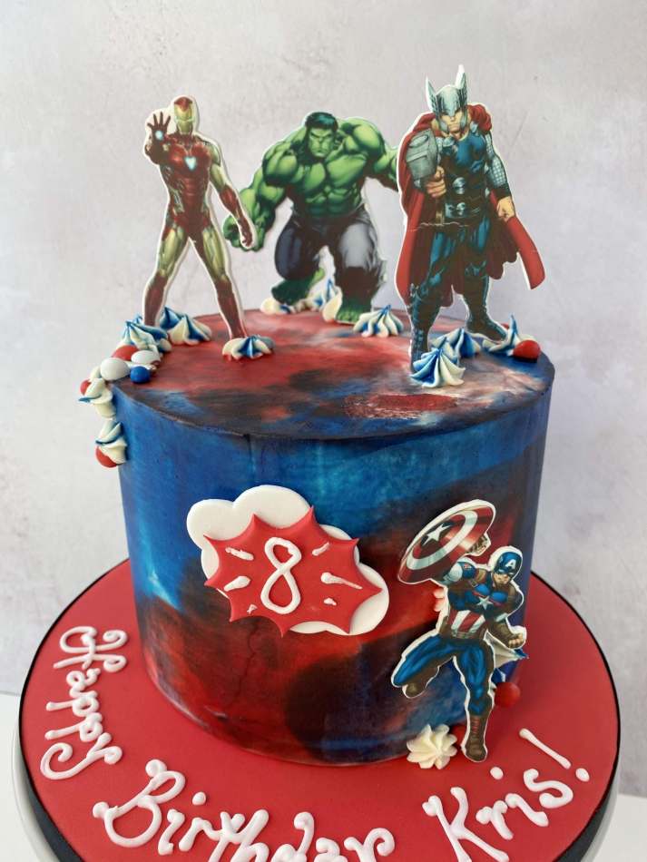Hugs & Kisses Celebration Cakes - Avengers cake featuring hand crafted 3D  models and 2D images: A 3D model of Hulk's familiar green fist bursting out  of the cake; Iron Man's mask;