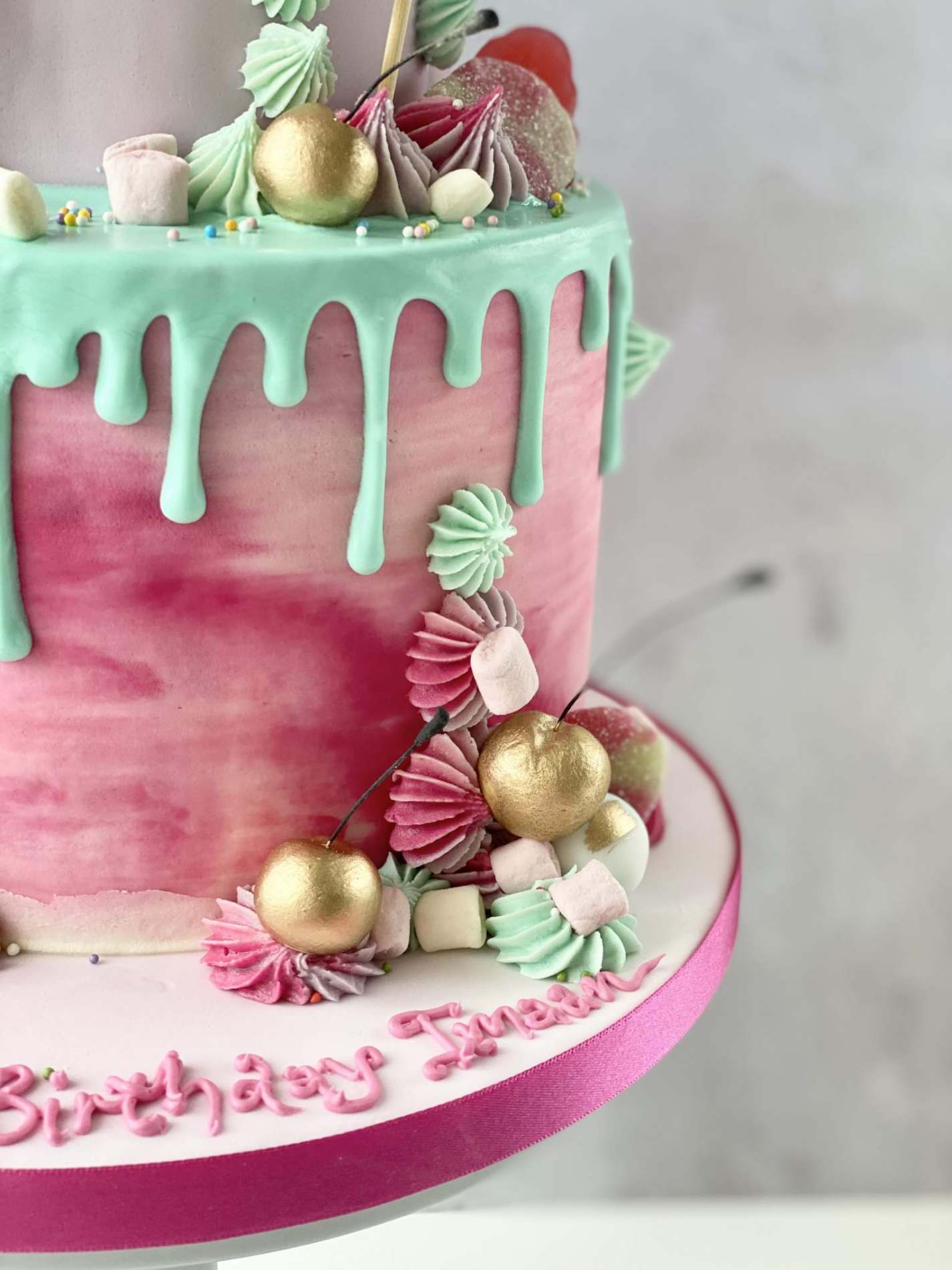 Two tier bright candy cake with golden cherries | Birthdays