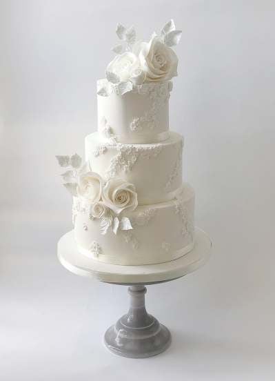 White Embossed cake with Sugar Roses | Wedding Cakes